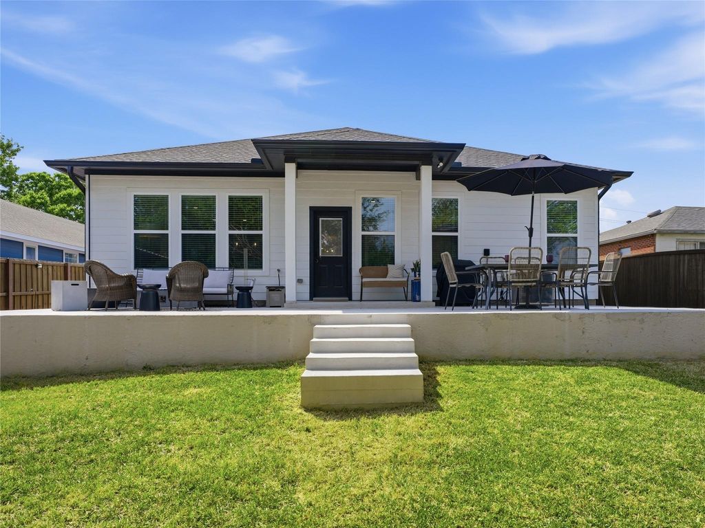 Kitchen with granite countertops, custom cabinetry, and island